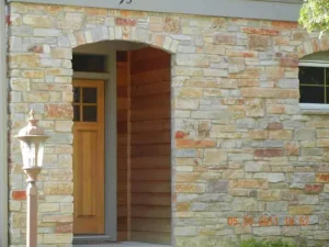 masonry project - stone wall around archway for door