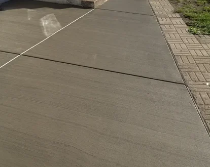 Fresh concrete sidewalk at front door